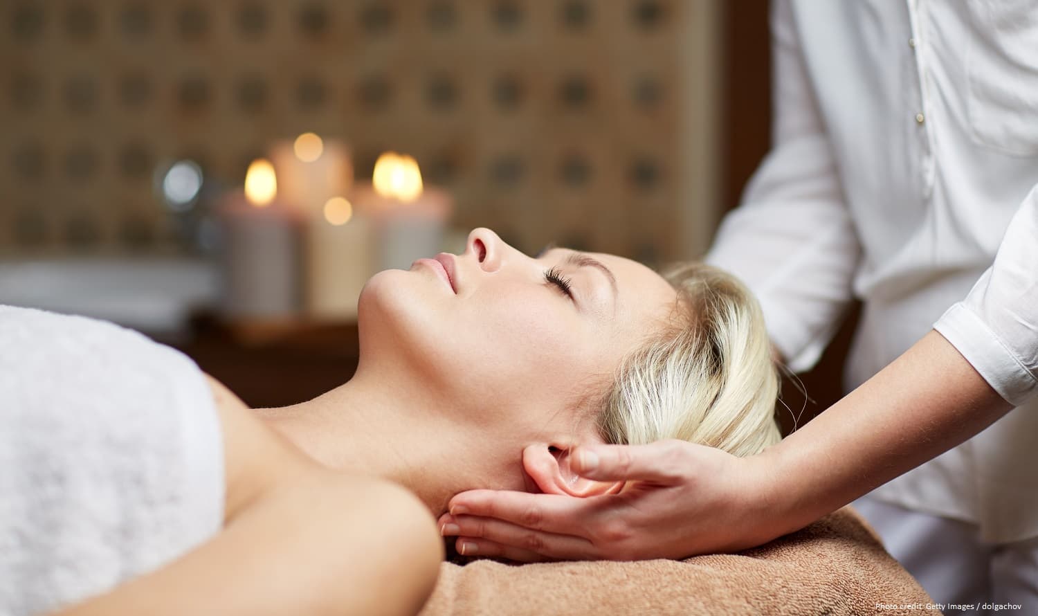 A woman receiving a massage in a calming spa environment. A woman receiving a massage in a calming spa environment.